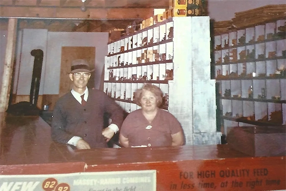 Vintage photo of W.J. Lambert & Sons founders behind the parts counter at the original dealership