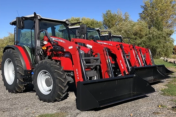 Row of Massey Ferguson loader tractors displayed on the lot in Beaverton, Ontario